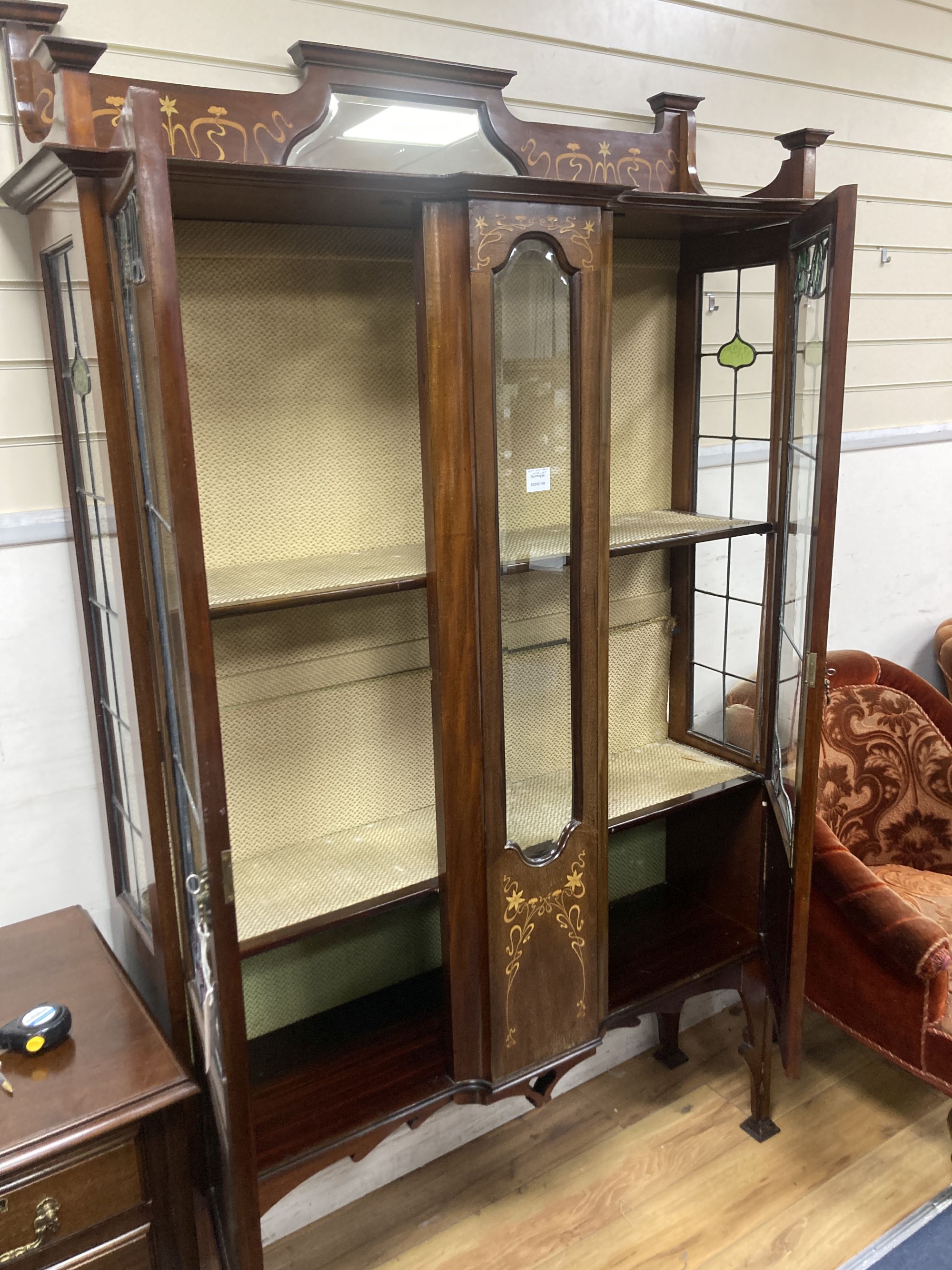 An Edwardian Art Nouveau marquetry inlaid mahogany display cabinet,